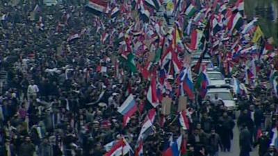 Crowds waving flags in Damascus