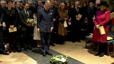 Prince Charles laying wreath