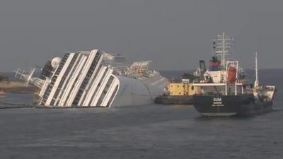 Costa Concordia and barges