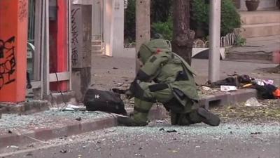 Bomb disposal crew at the site of one of the blasts