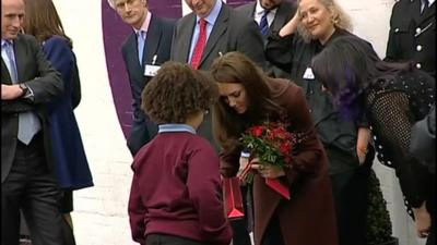 The Duchess of Cambridge accepting a gift