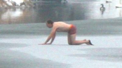 Malcolm Jarvis crawling across ice