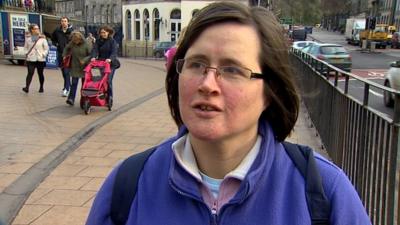 Woman standing in the street in Edinburgh