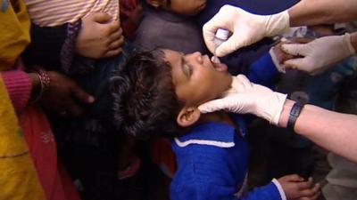 Child being given polio vaccine