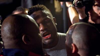 Chisora speaks to Adam Booth following the brawl with Haye