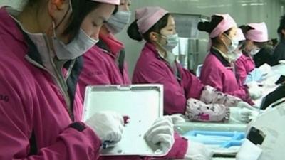 Workers on Foxconn production line in China