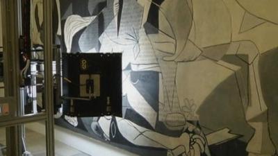 The robotic camera takes an image of Picasso's Guernica