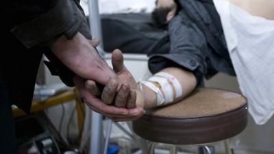 Wounded man being treated in the Baba Amr district of Homs in Syria