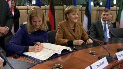 EU leaders sign new debt treaty.