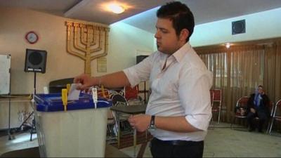 A Jewish man votes in Iran's parliamentary elections