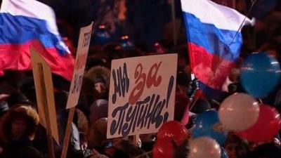 Posters at Putin victory rally