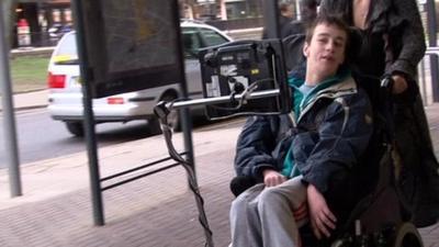 Nathan Popper in a wheelchair in the city centre