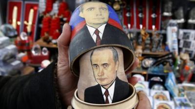 A traditional Matryoshka doll bearing the faces of Vladimir Putin (bottom) and Dmitry Medvedev.