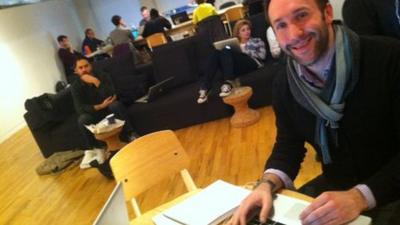 A man working on his laptop at General Assembly