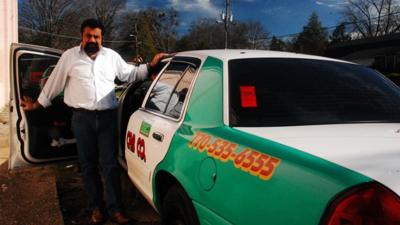 Jose Luis Diaz and his cab