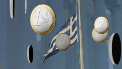 One euro coins and Greek flag