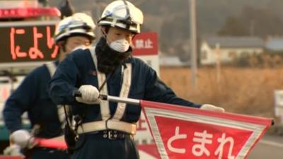 Man holding stop sign