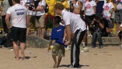 Prince Harry taking part in a rugby game