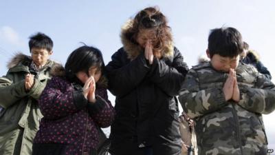 Family say prayers for tsunami victims
