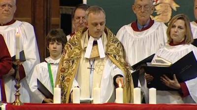 Candles are lit at Halifax Minster