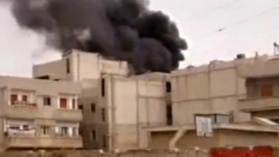 Burning building in Homs