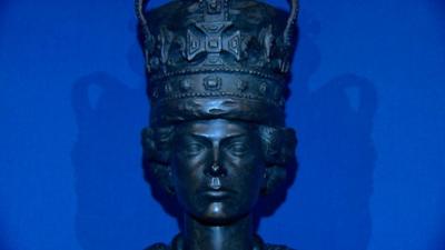 Close up of sculpture of present Queen as a young woman