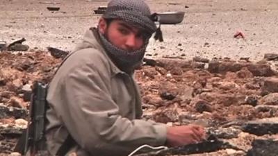 Man laying street explosives in Idlib