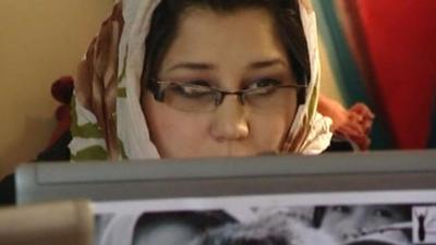 Afghan woman in the internet cafe