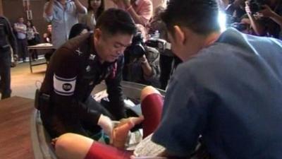 Traffic police officer being trained to deliver a baby