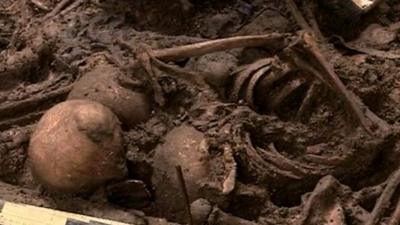 Human remains in one of the mass graves