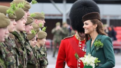 The Duchess of Cambridge hands our shamrocks to the guards