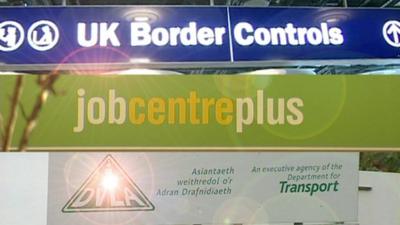 UK border control, job centre and DVLA signs