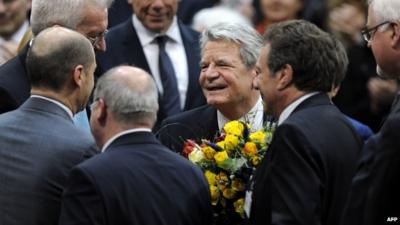 Joachim Gauck being congratulated by politicians in Germany's parliament