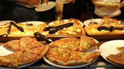 Pizzas at buffet stand