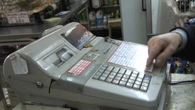 Cash register in small food shop