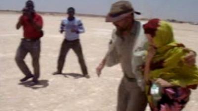 Judith Tebbutt is led to a waiting plane