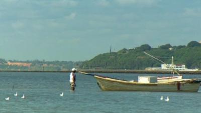 A boat moored just off the coast