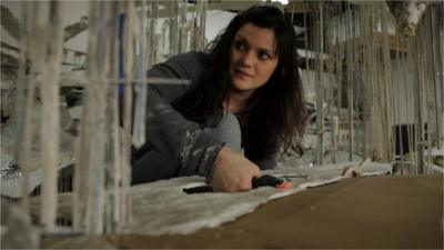 Artist Diana Al-Hadid works on one of her sculptures.