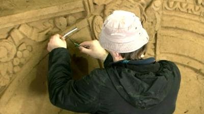 Man working on sand castle