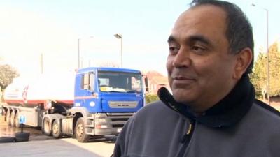 Petrol station owner Shailesh Parekh with tanker in the background