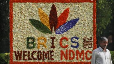 A sign made of fresh flowers with the BRICS Summit logo on it in New Delhi, India.