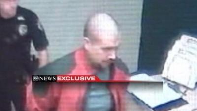 Still image of George Zimmerman being led into Sanford Police Department.