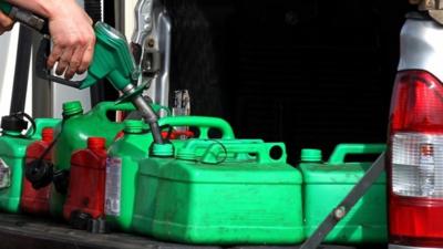 Petrol cans being filled up