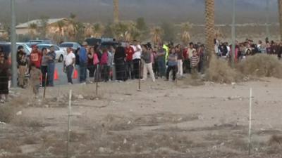 People queue down road for lottery tickets