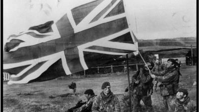 British troops raising a British flag in the Falkland Islands during the Falklands war with Argentina