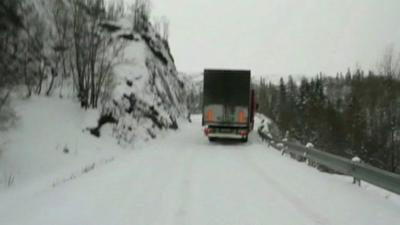 Truck on a snowy road in Norway