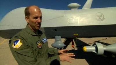 Col Ken Johnson in front of an unmanned aircraft