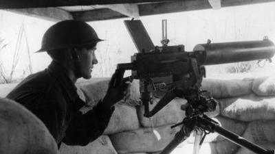 American WWI soldier mans machine gun