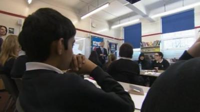 Pupils sit in classroom