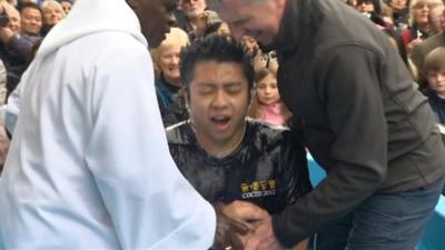 A person being baptised by the Archbishop of York